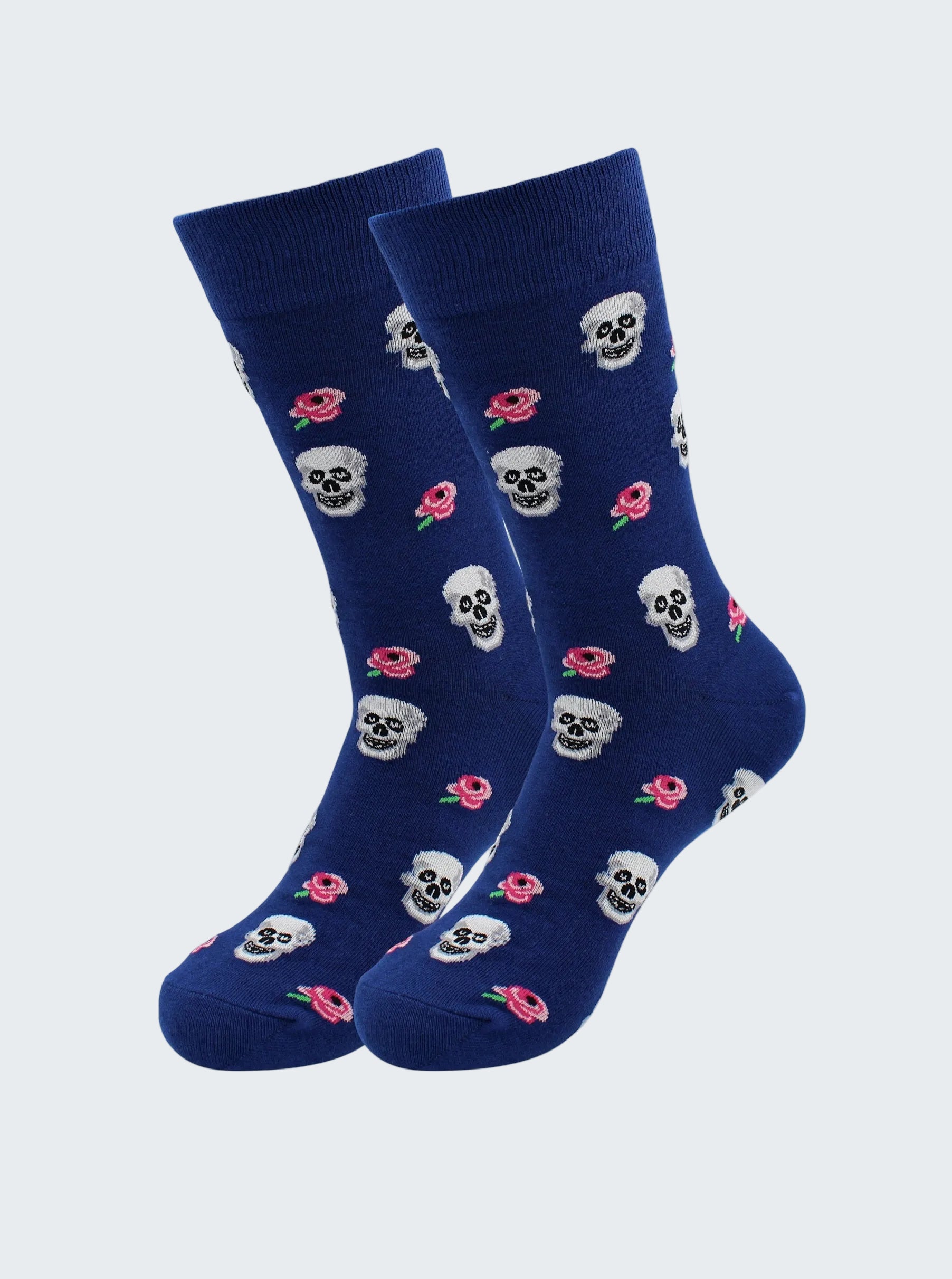 Pair of blue socks with skull and flower pattern on a white background