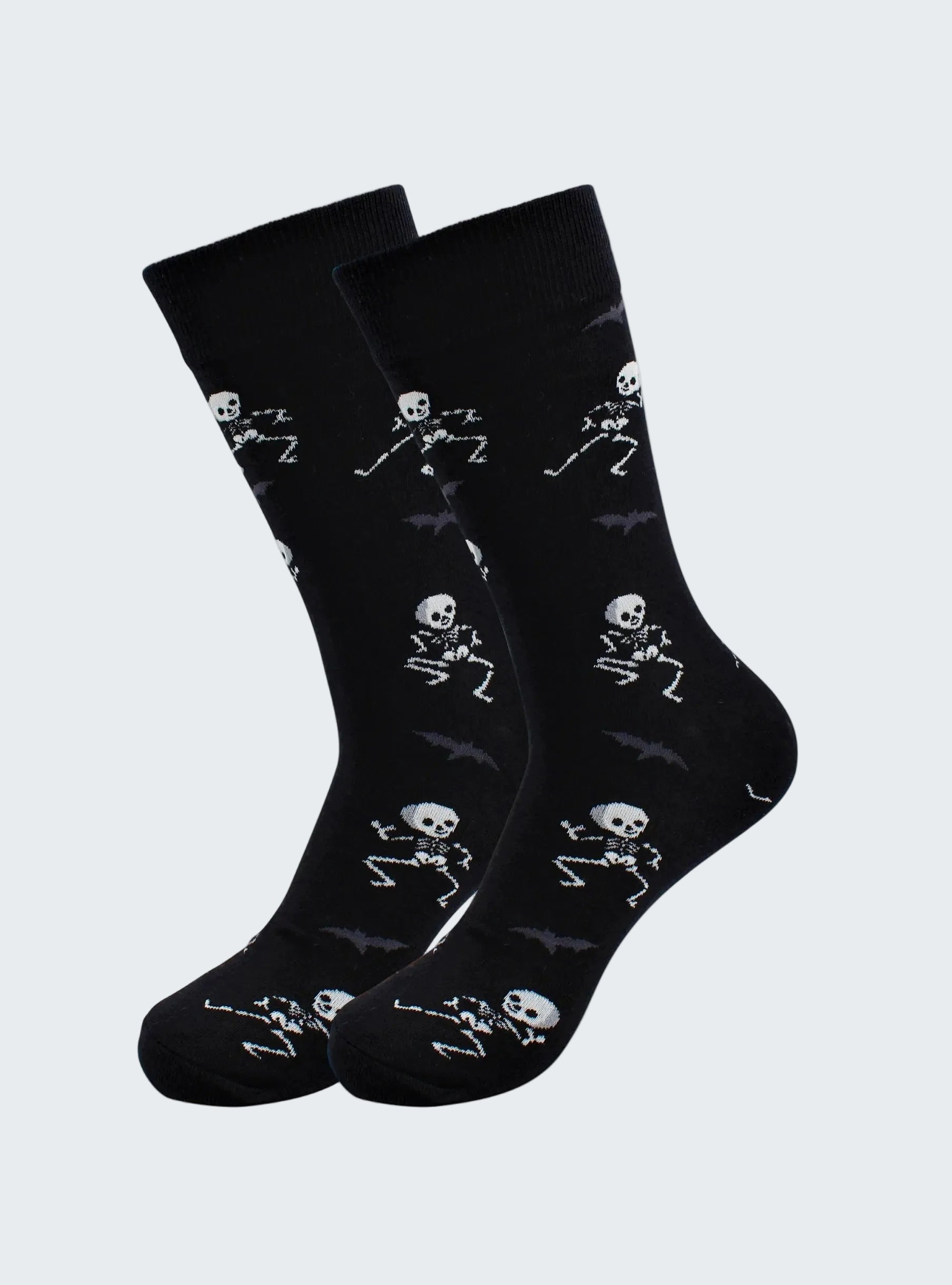 Black socks with skeleton designs on a white background