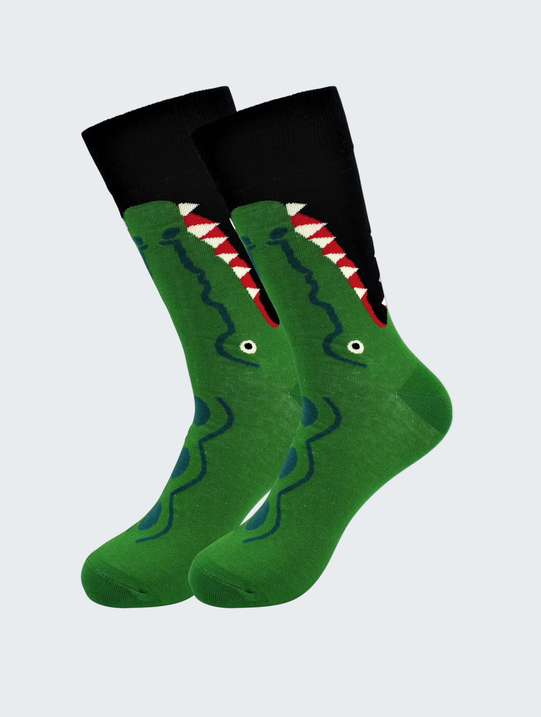 Green socks with a shark design on a white background