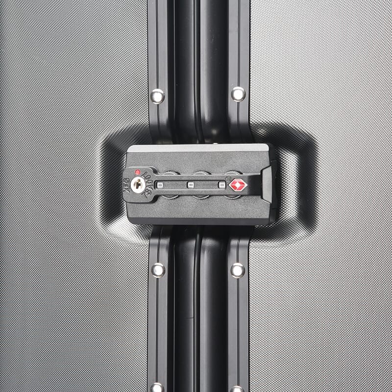 Close-up of a suitcase handle with a gray background