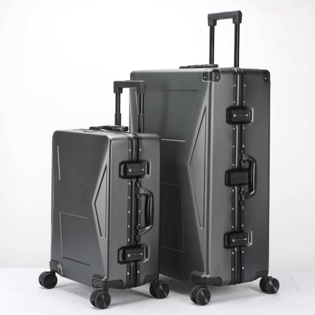 Two black suitcases with geometric designs on a white background