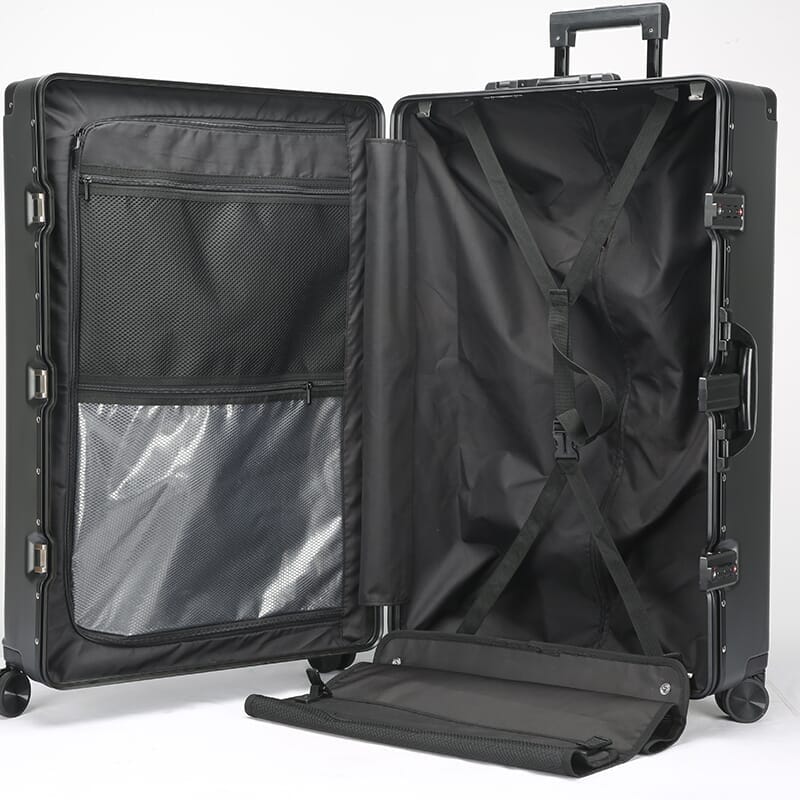 Black suitcase with open lid on a white background