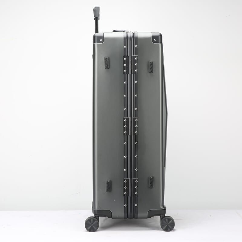 Silver suitcase with wheels on a white background