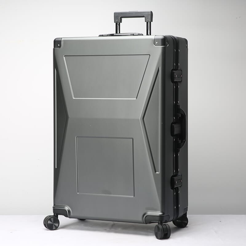 Gray suitcase with black accents on a white background