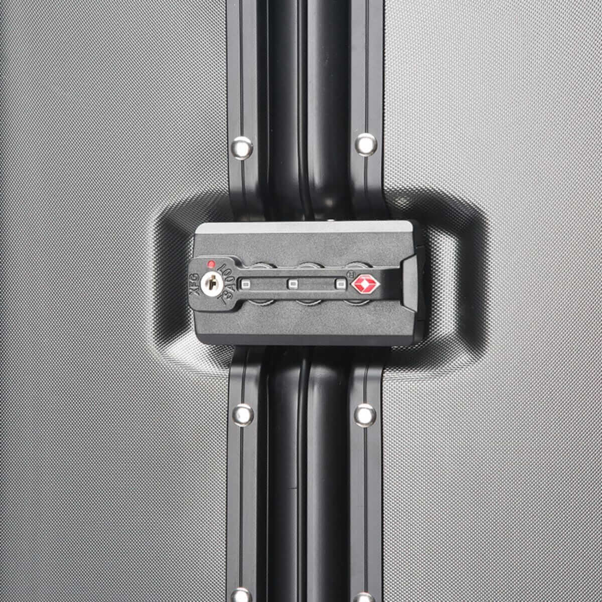 Close-up of a suitcase handle on a gray textured background