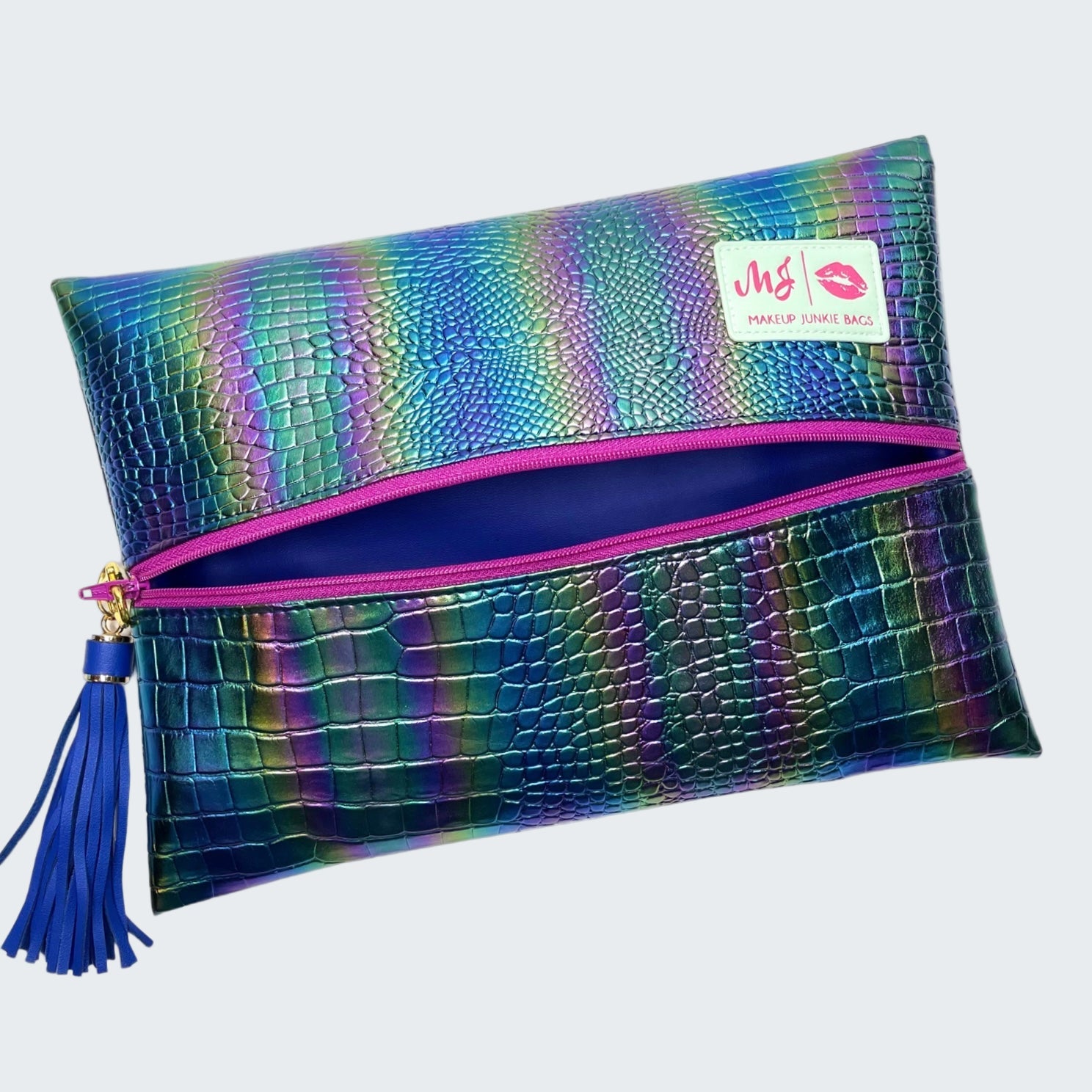 Multicolored textured pouch with pink zipper and blue tassel on a white background