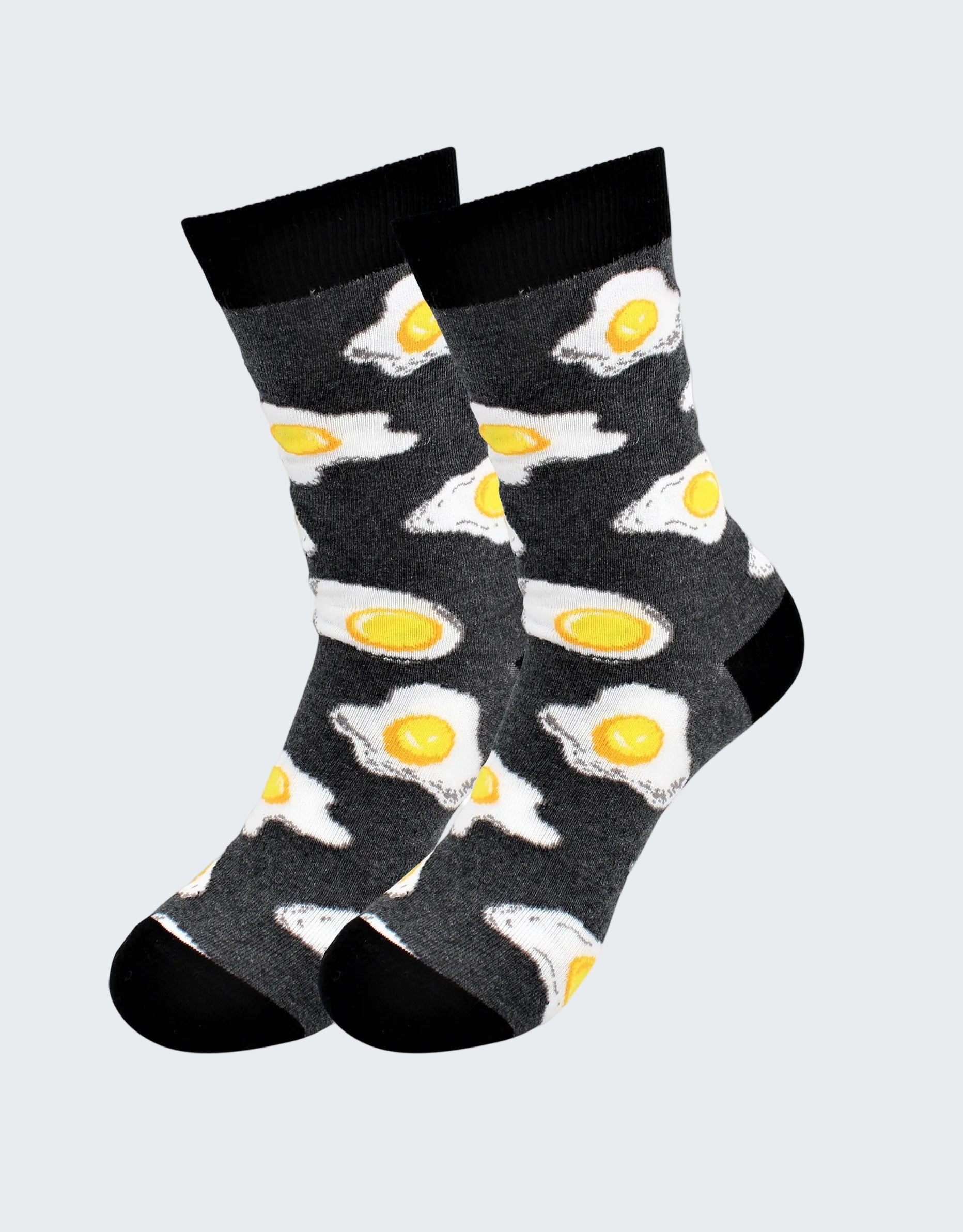 Pair of socks with fried egg design on a white background
