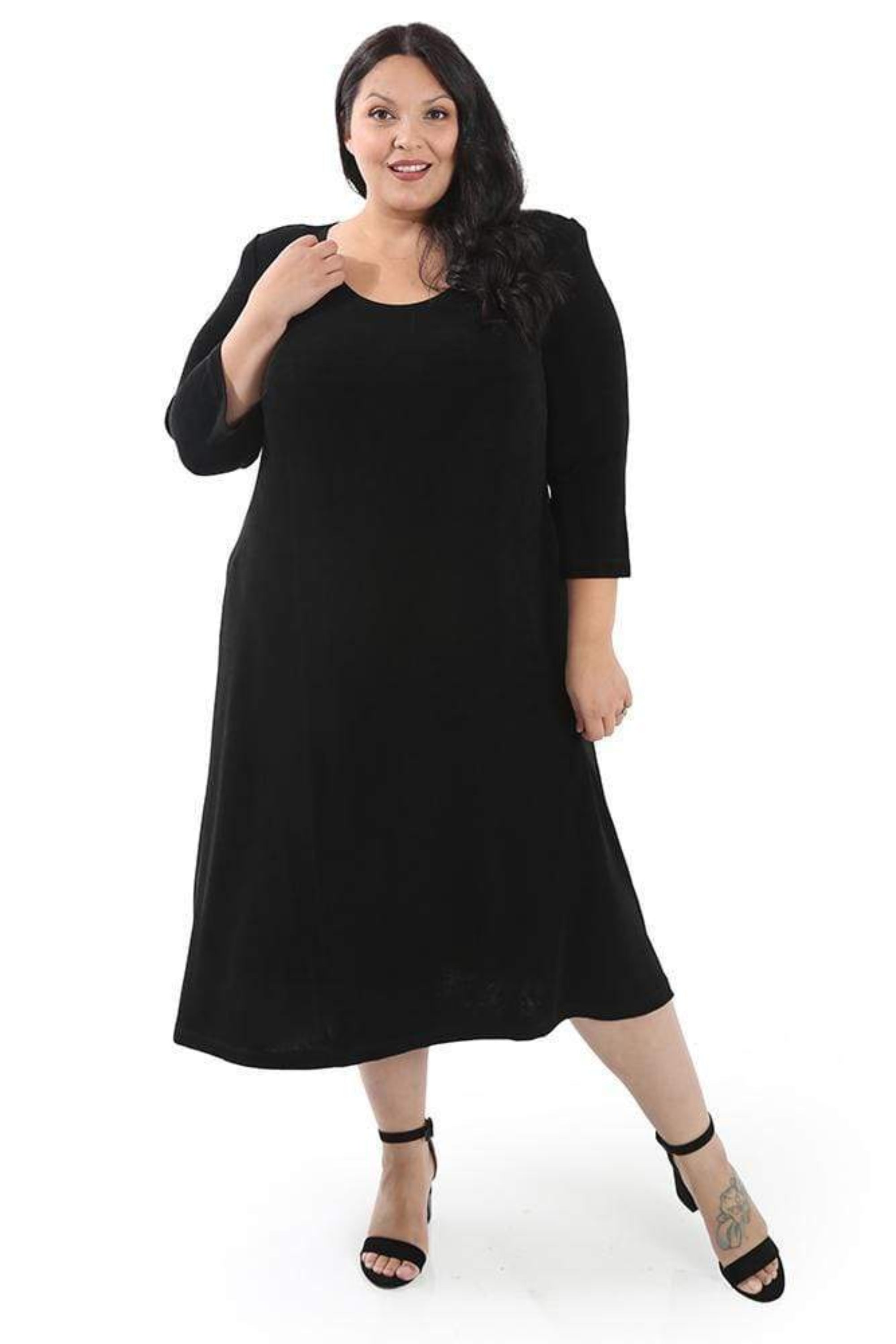 Woman wearing a black dress on a white background