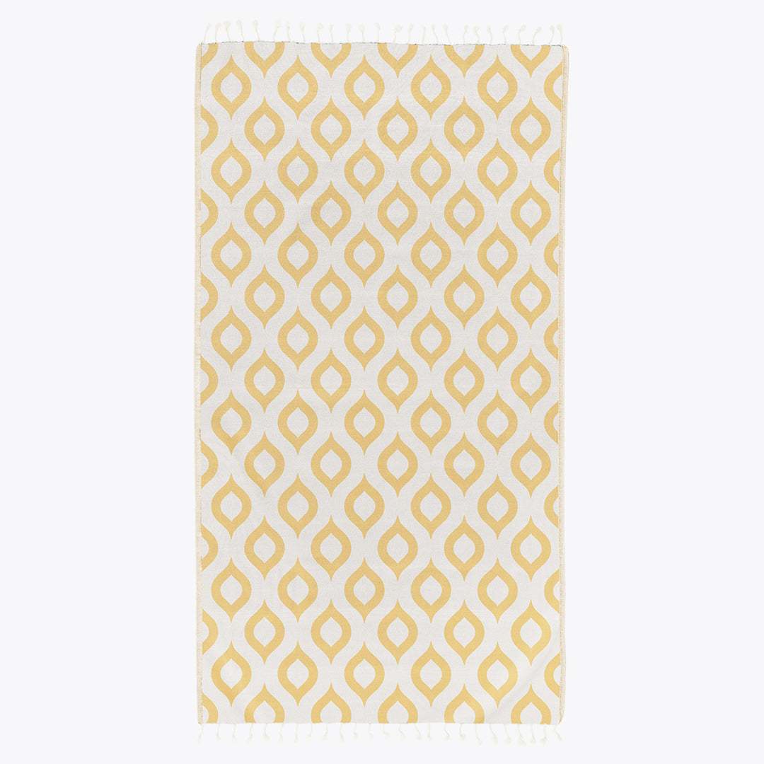 Yellow geometric patterned towel on a white background