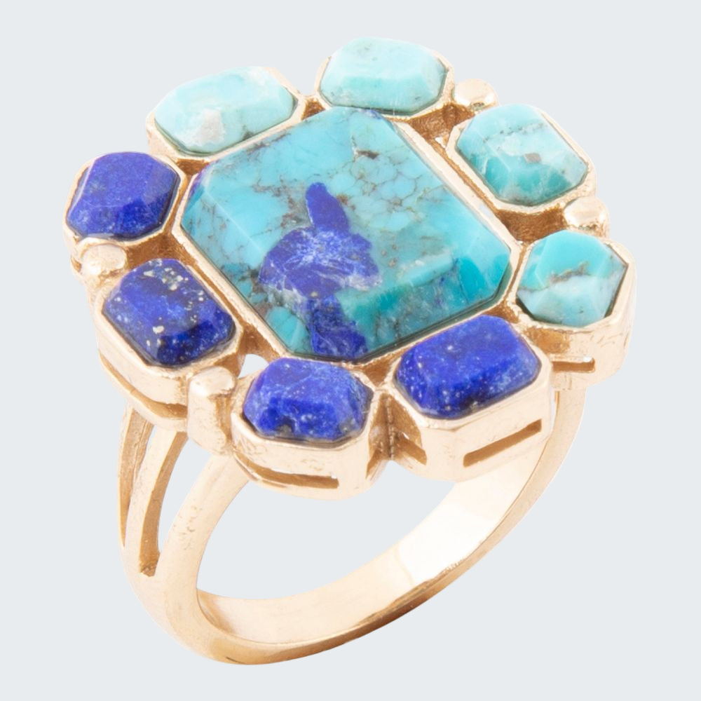 Ring with turquoise and blue stones on a white background