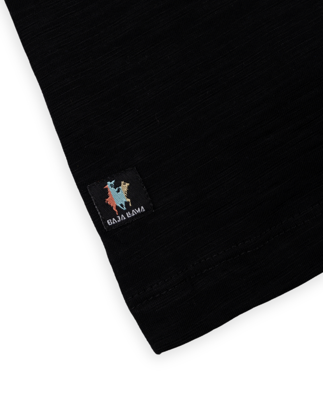 Close-up of a black sweater with a colorful logo on a white background