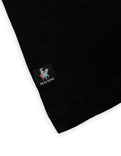 Close-up of a black sweater with a colorful logo on a white background
