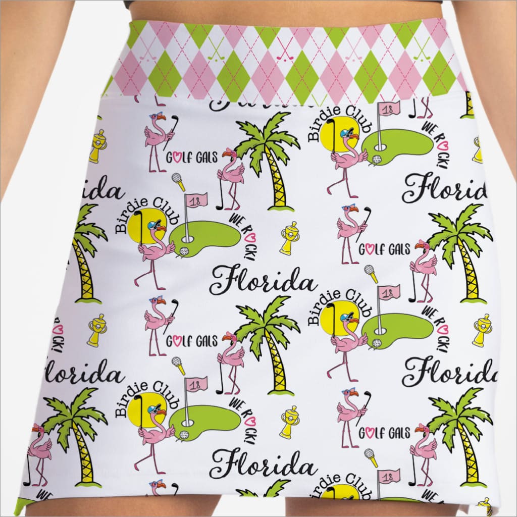 Skirt with Florida-themed design featuring flamingos, palm trees, and golf clubs on a white background.