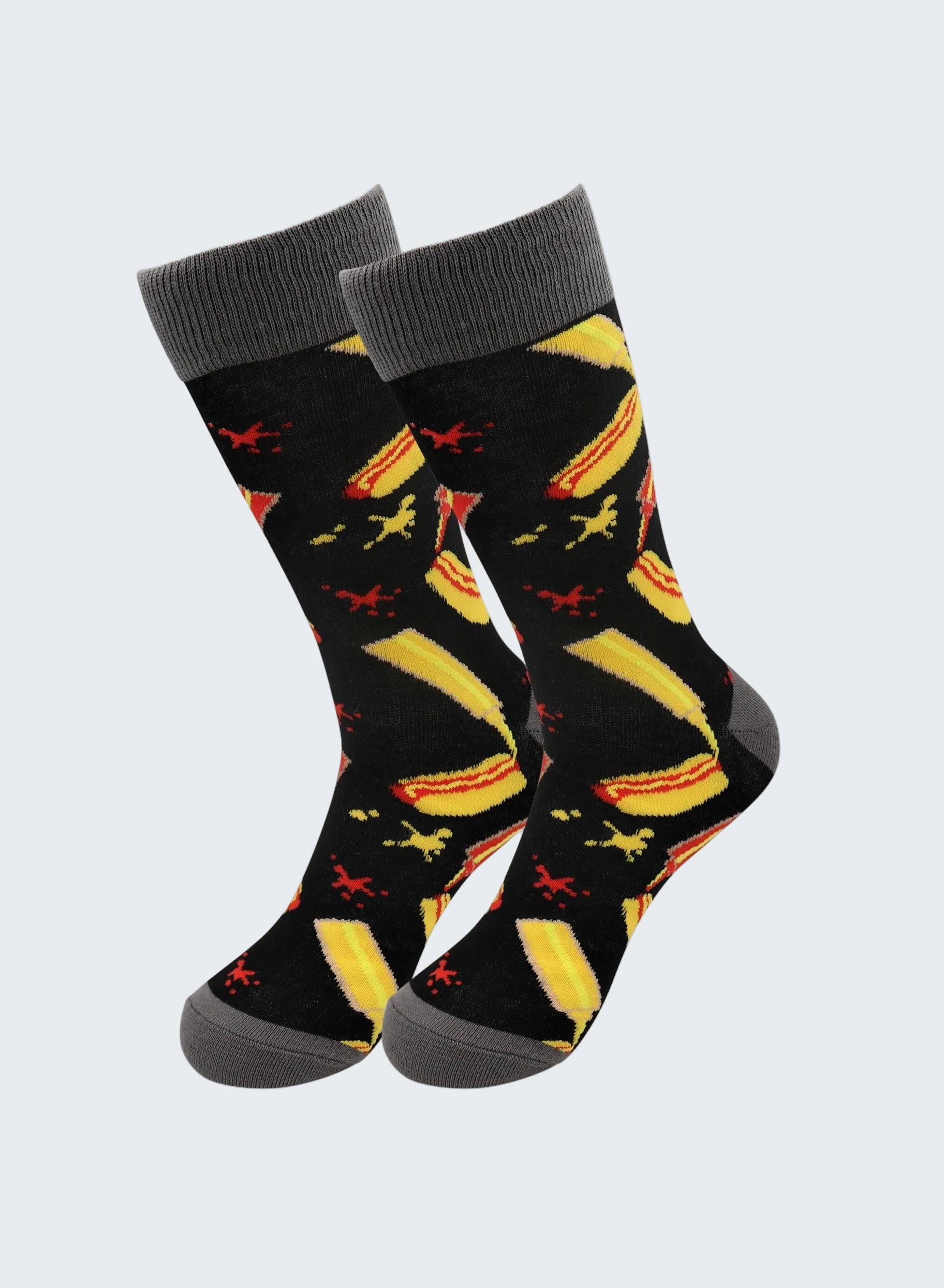 Pair of socks with banana and airplane pattern on a white background