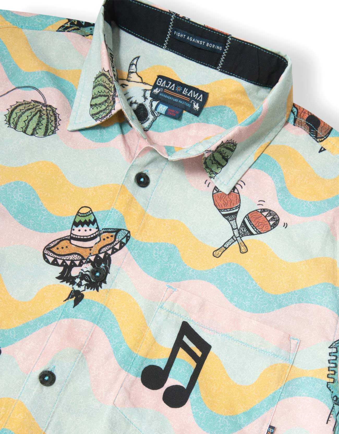 Colorful shirt with music notes, cacti, and sombrero design on a white background
