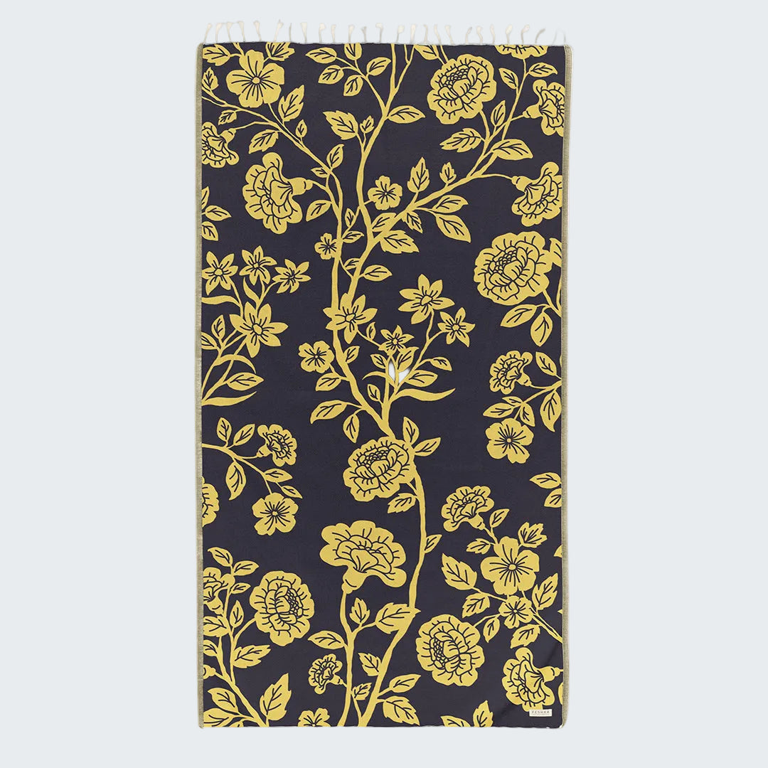 Floral patterned fabric with yellow flowers on a black background