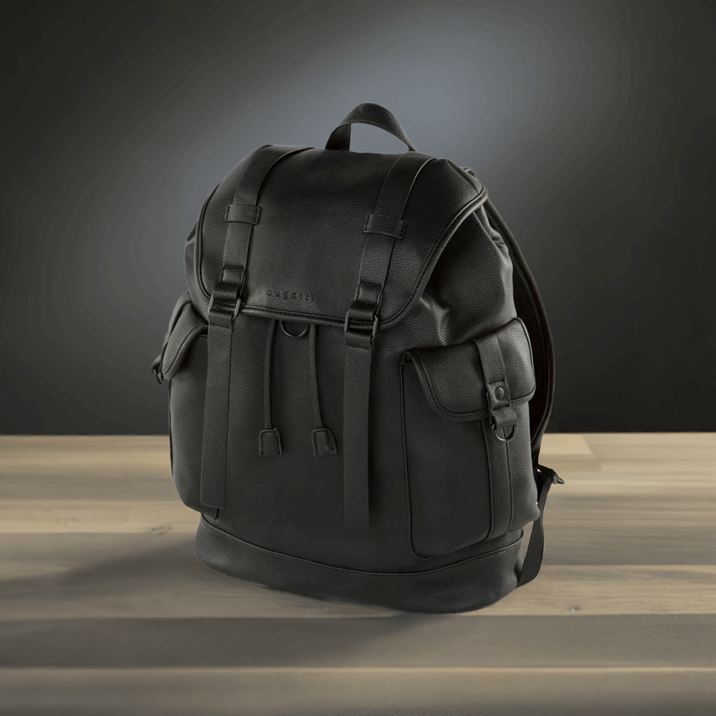 Black backpack on a wooden surface with a dark background