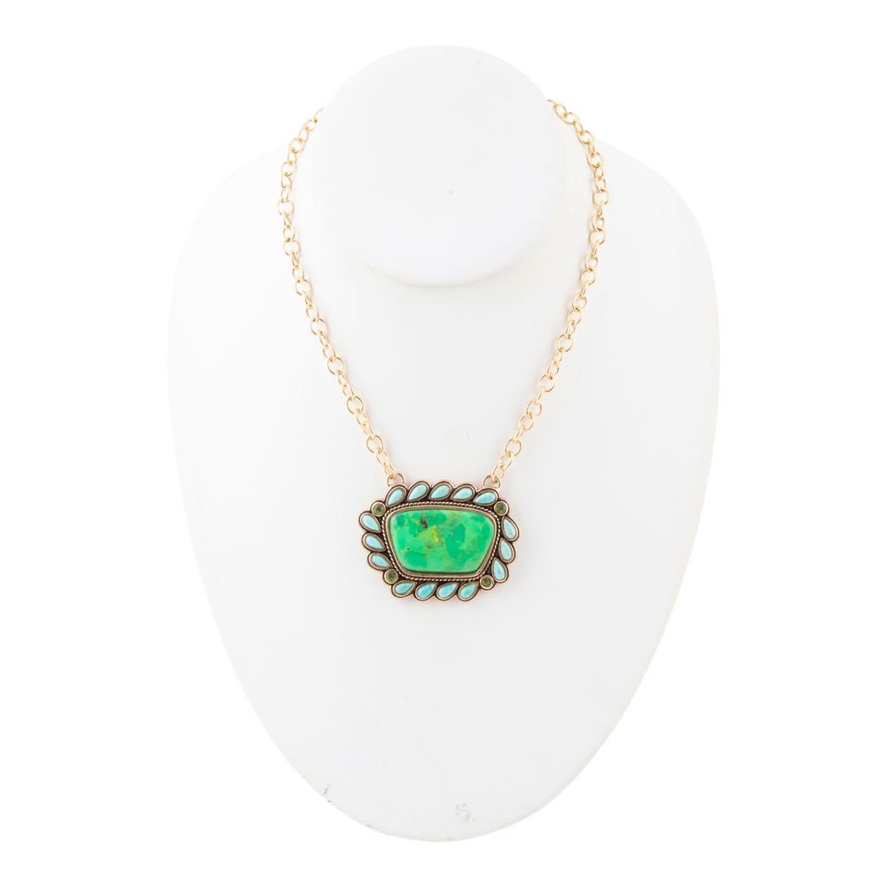 Necklace with a green pendant on a white background