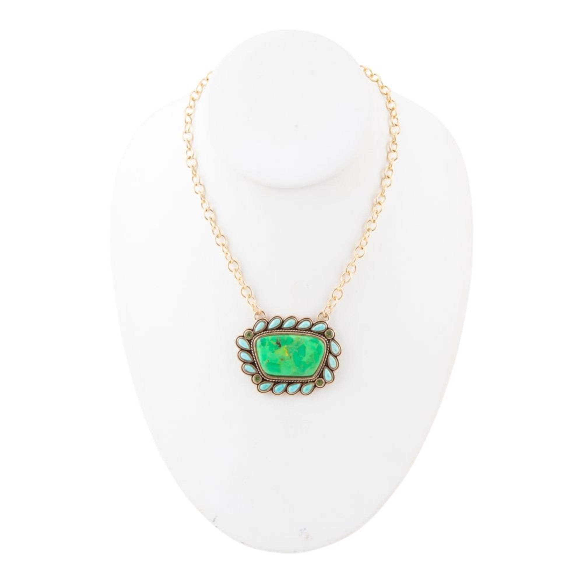 Necklace with a green pendant on a white background