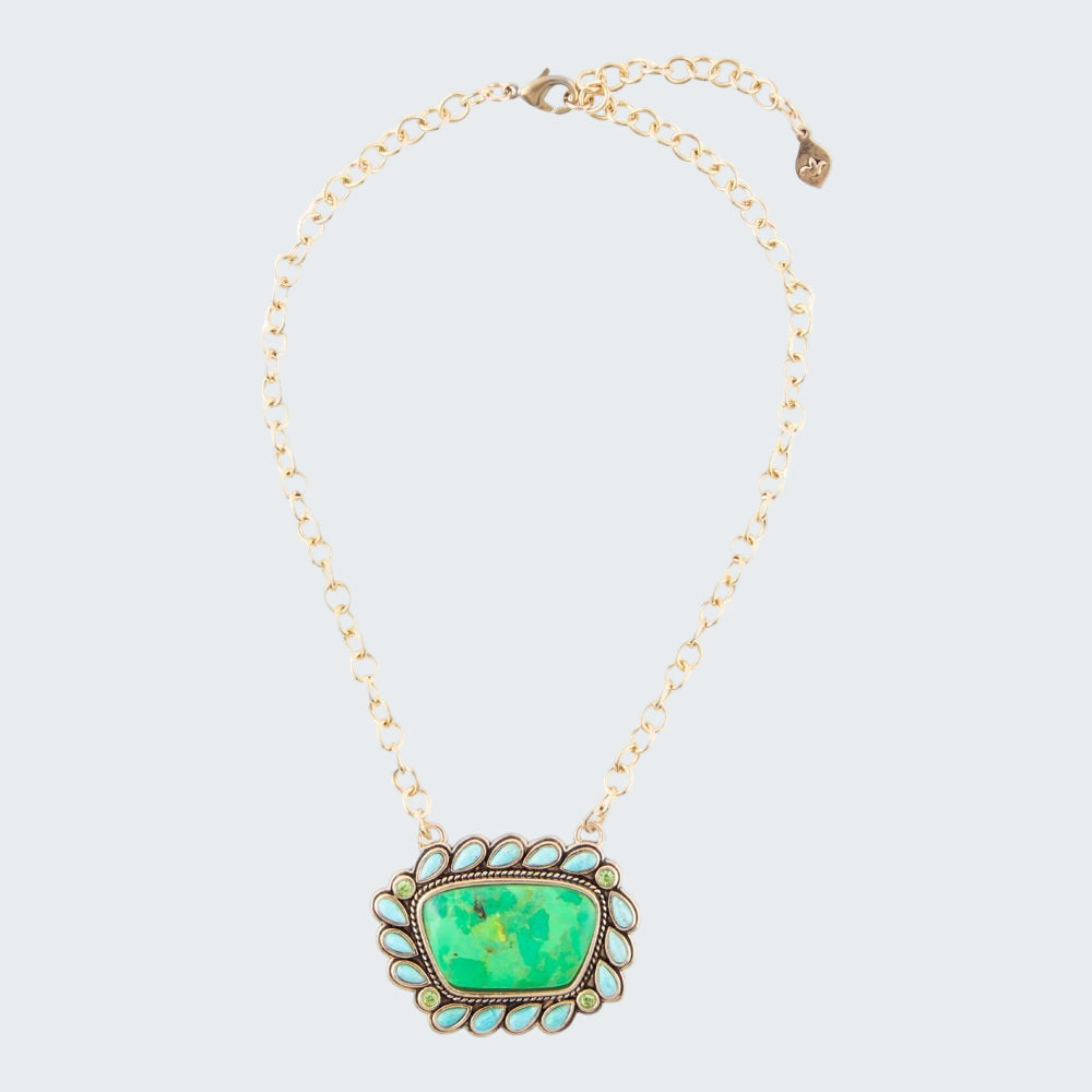 Necklace with a green pendant on a white background