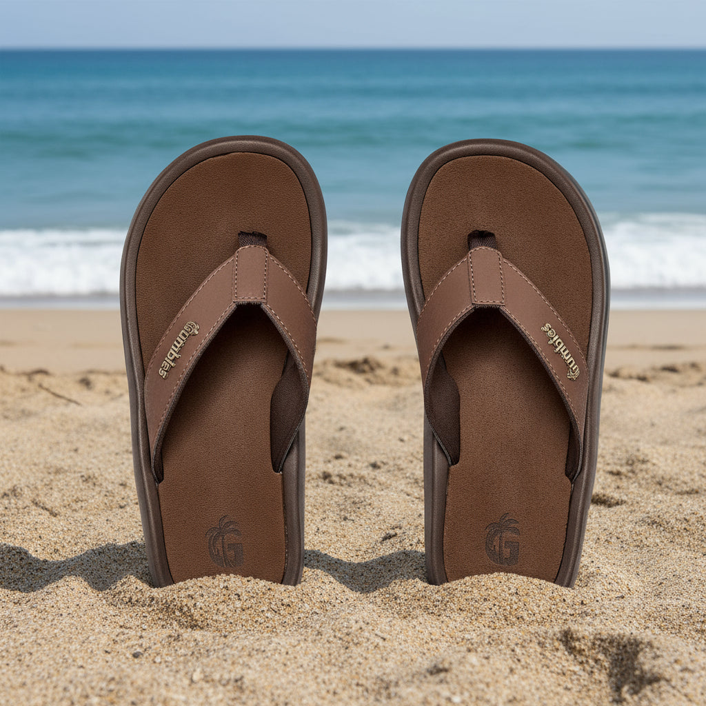 Pair of brown sandals with a visible brand logo on a white background