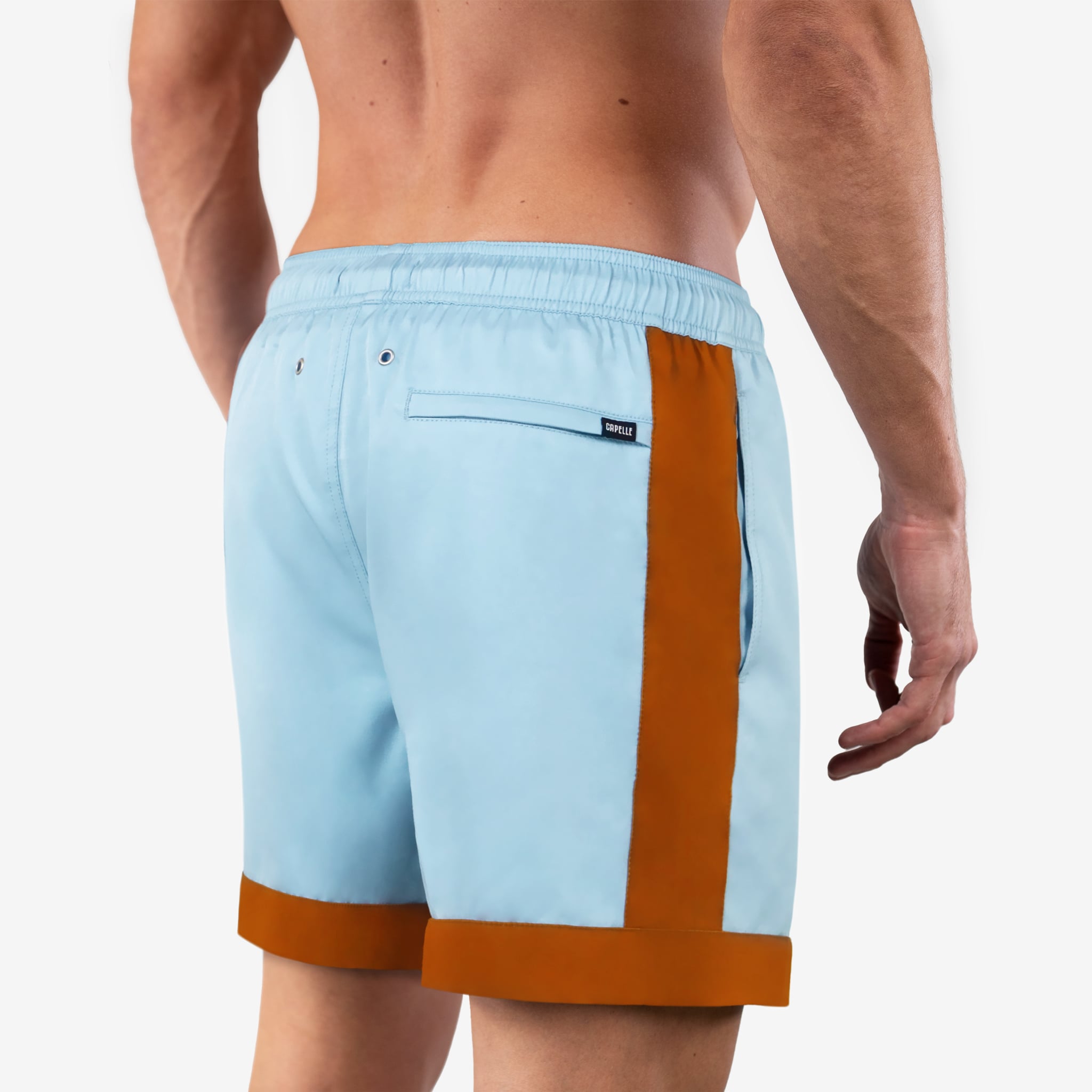 Light blue swim shorts with orange accents on a white background