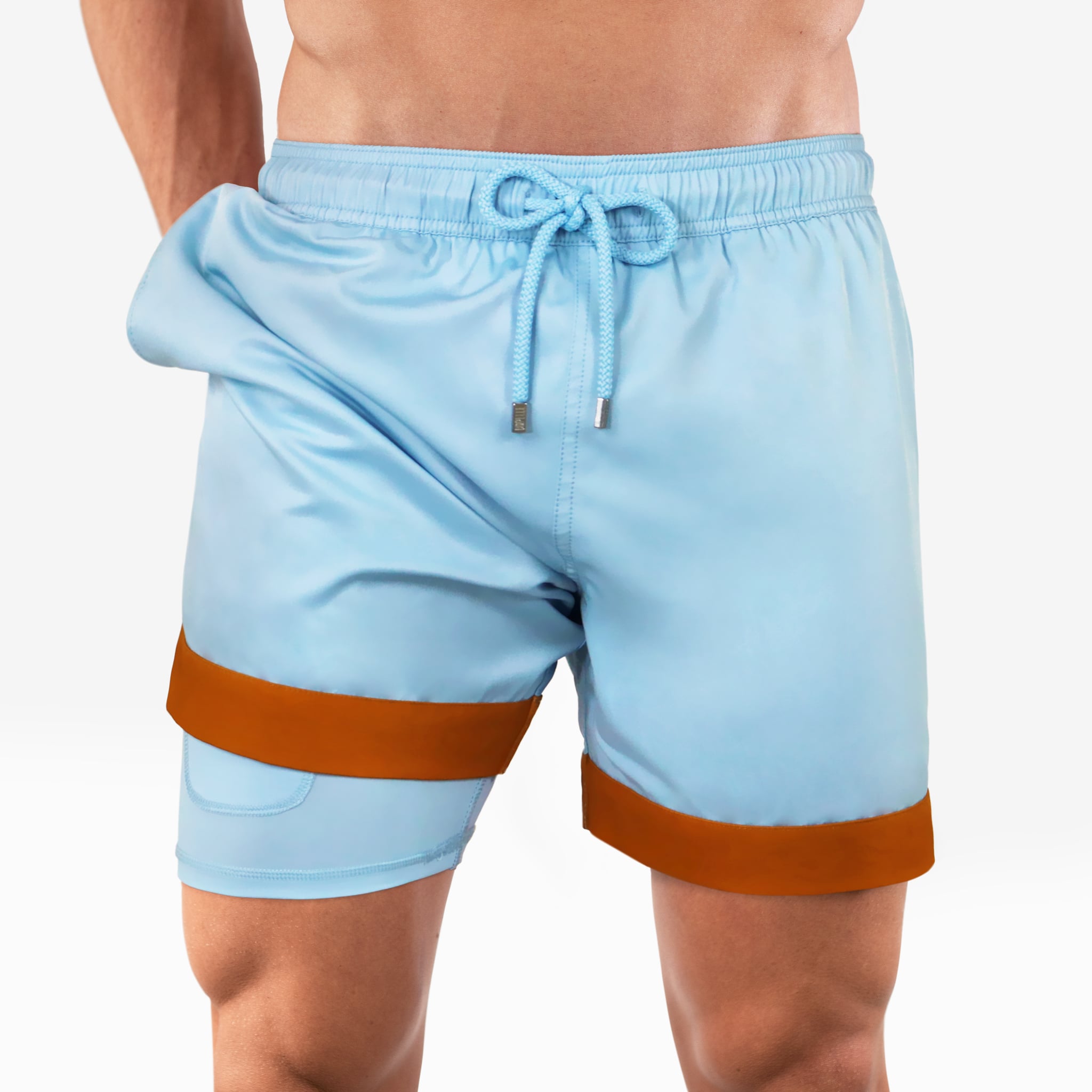 Light blue swim shorts with brown trim on a white background