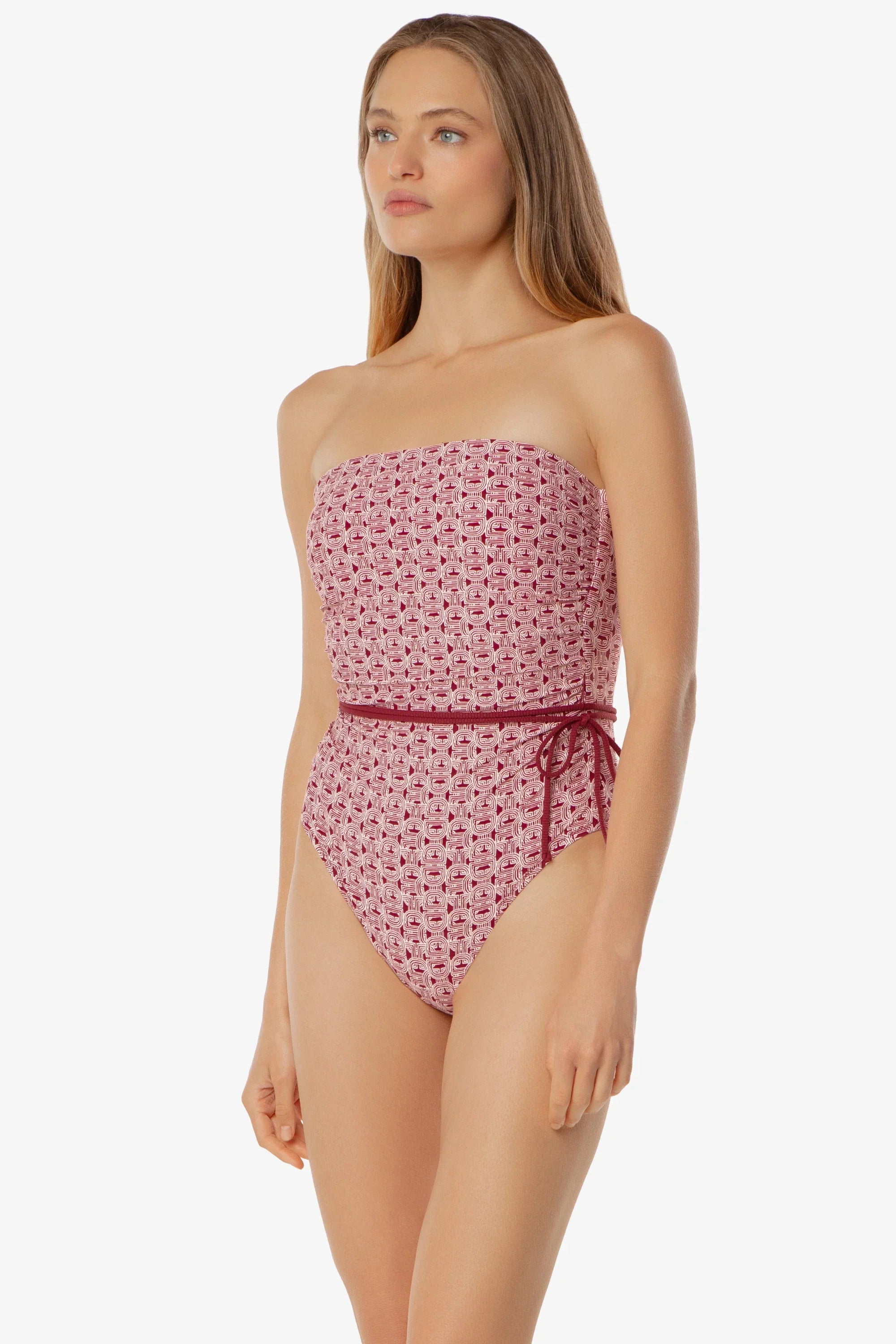 Woman wearing a strapless floral swimsuit on a white background