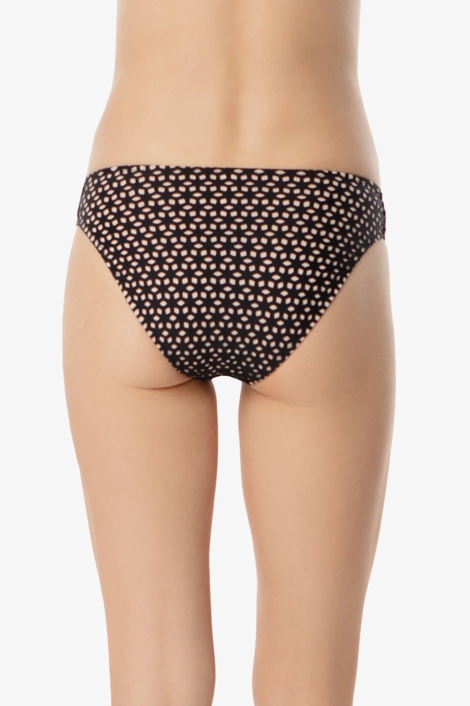 Black polka dot bikini bottom on a plain background