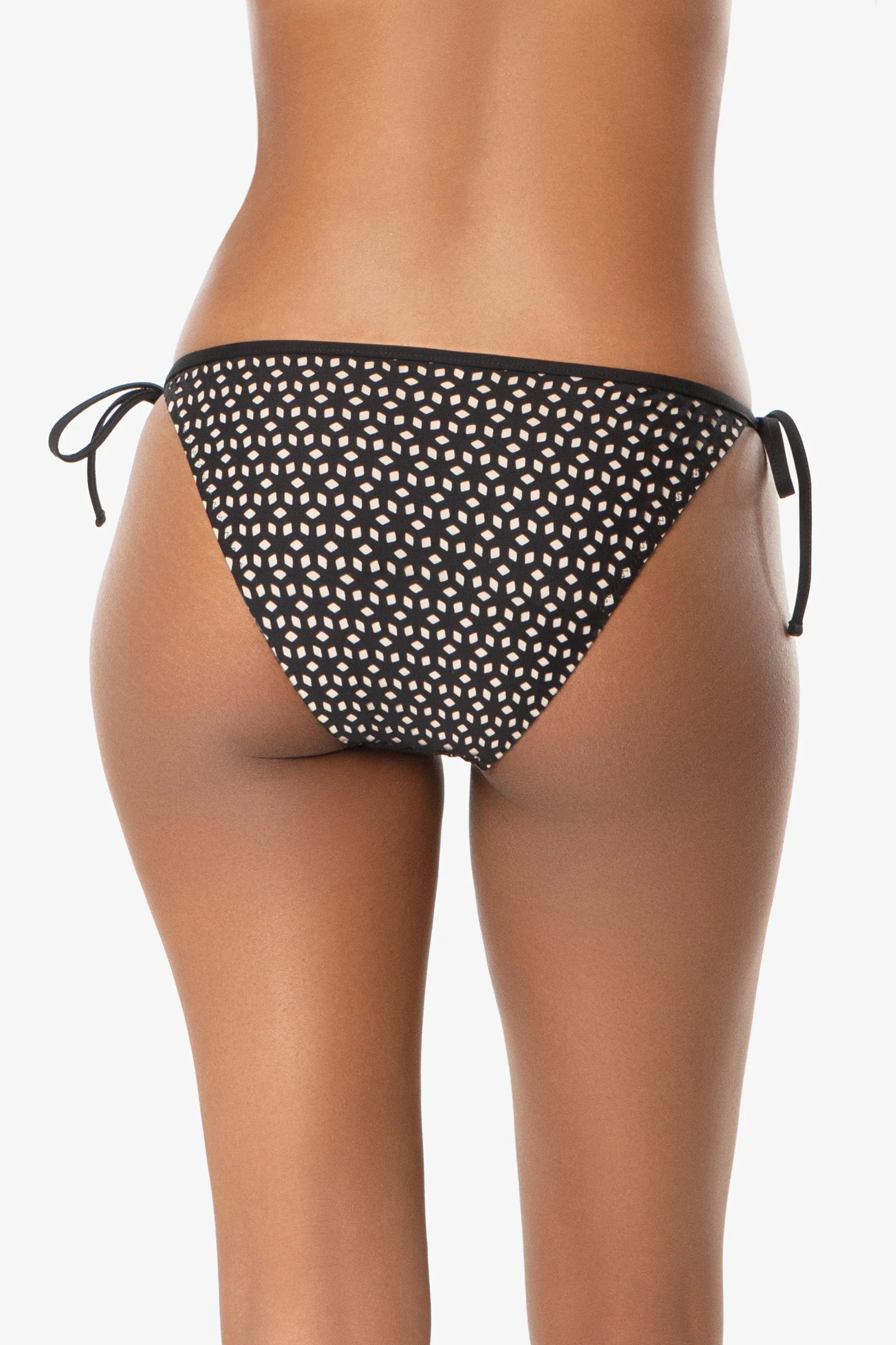 Black and white polka dot bikini bottom on a white background
