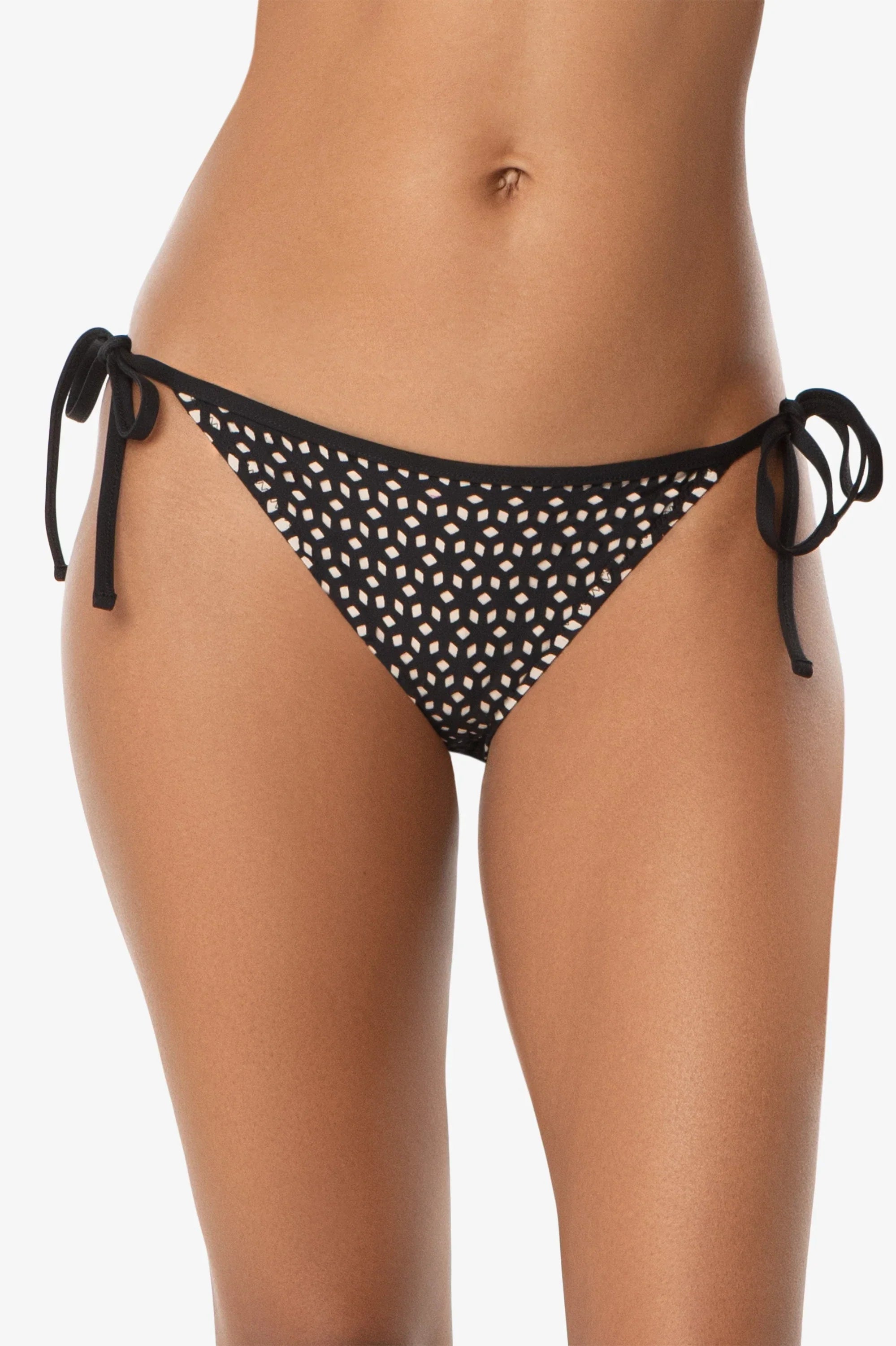Black polka dot bikini bottom on a white background