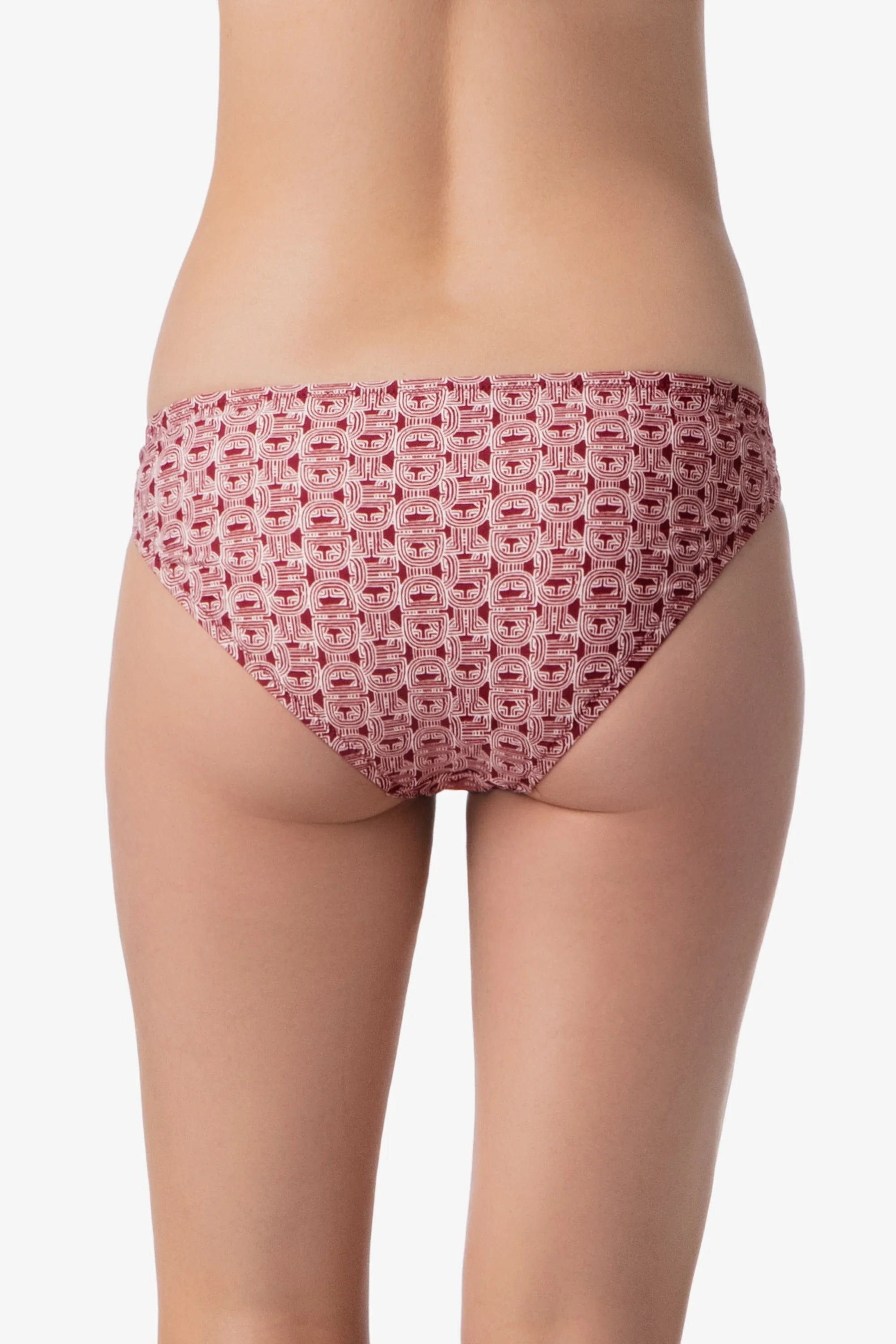 Red patterned underwear worn by a person on a white background