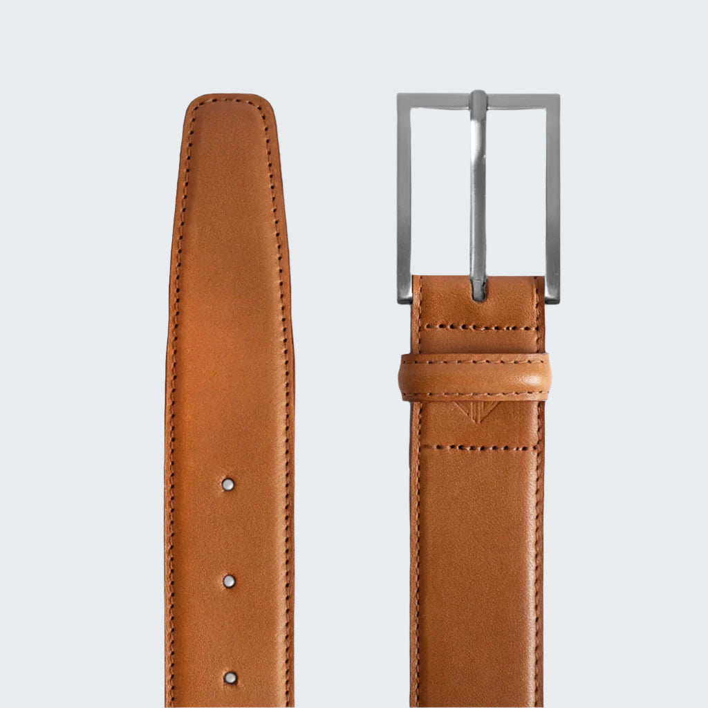 Brown leather belt with a silver buckle on a white background