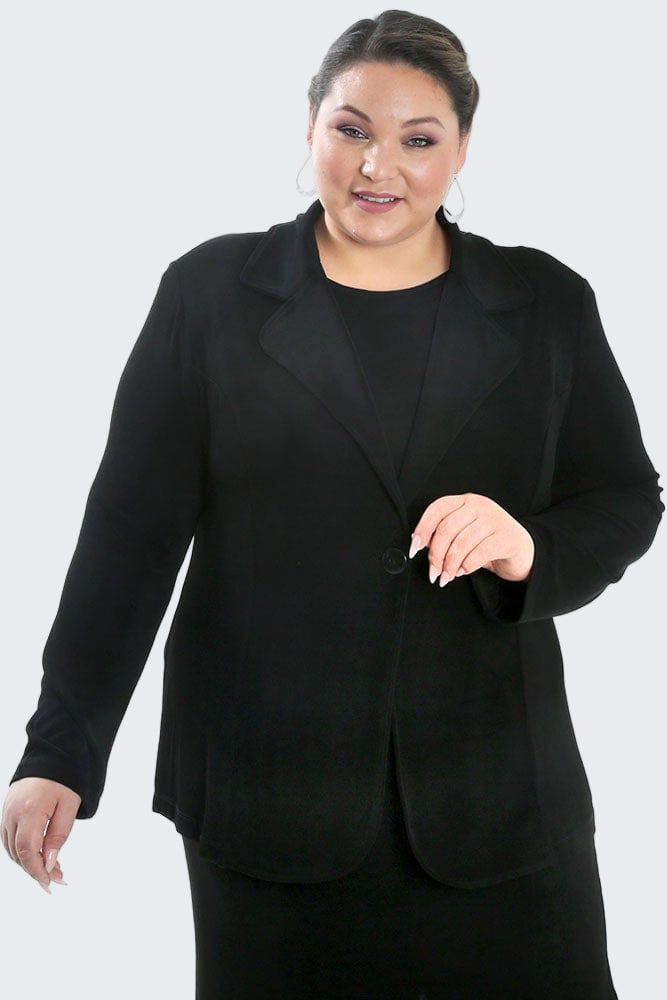 Woman wearing a black suit on a white background