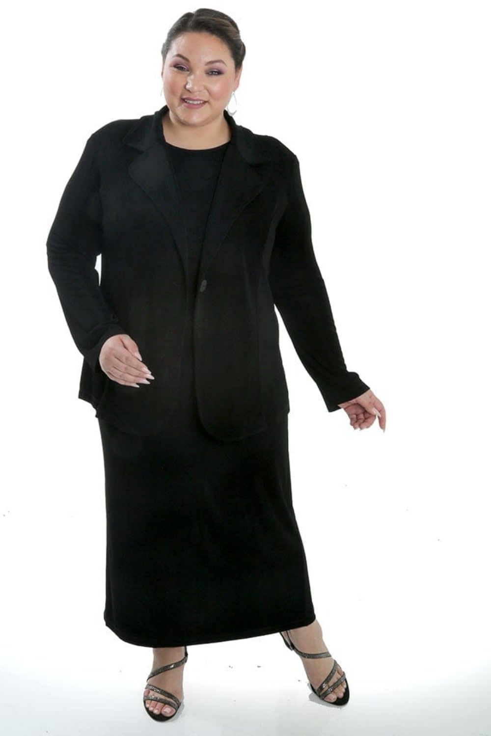 Woman wearing a black suit on a white background