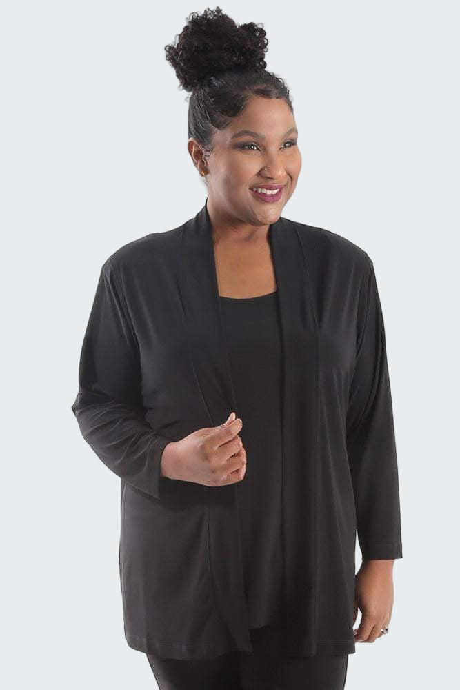 Woman wearing a black cardigan on a white background