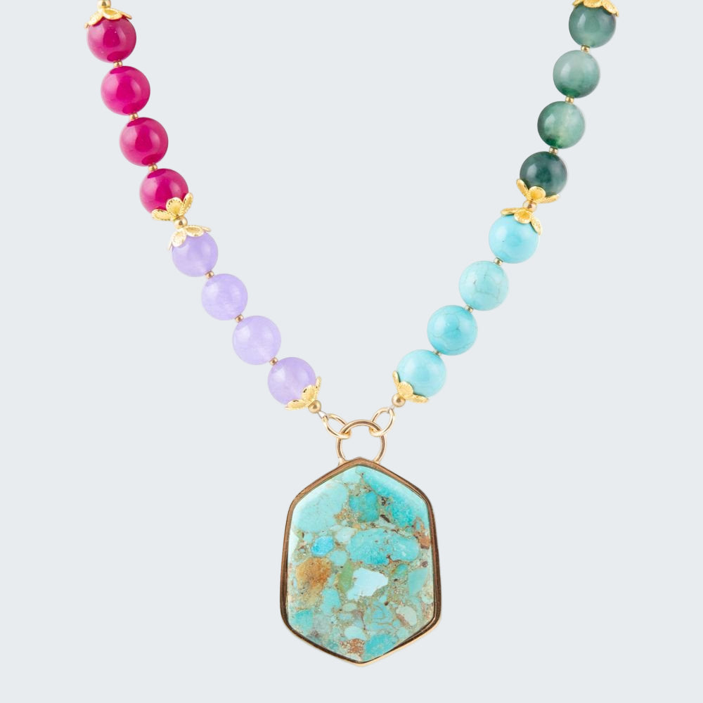 Necklace with colorful beads and a large turquoise pendant on a white background