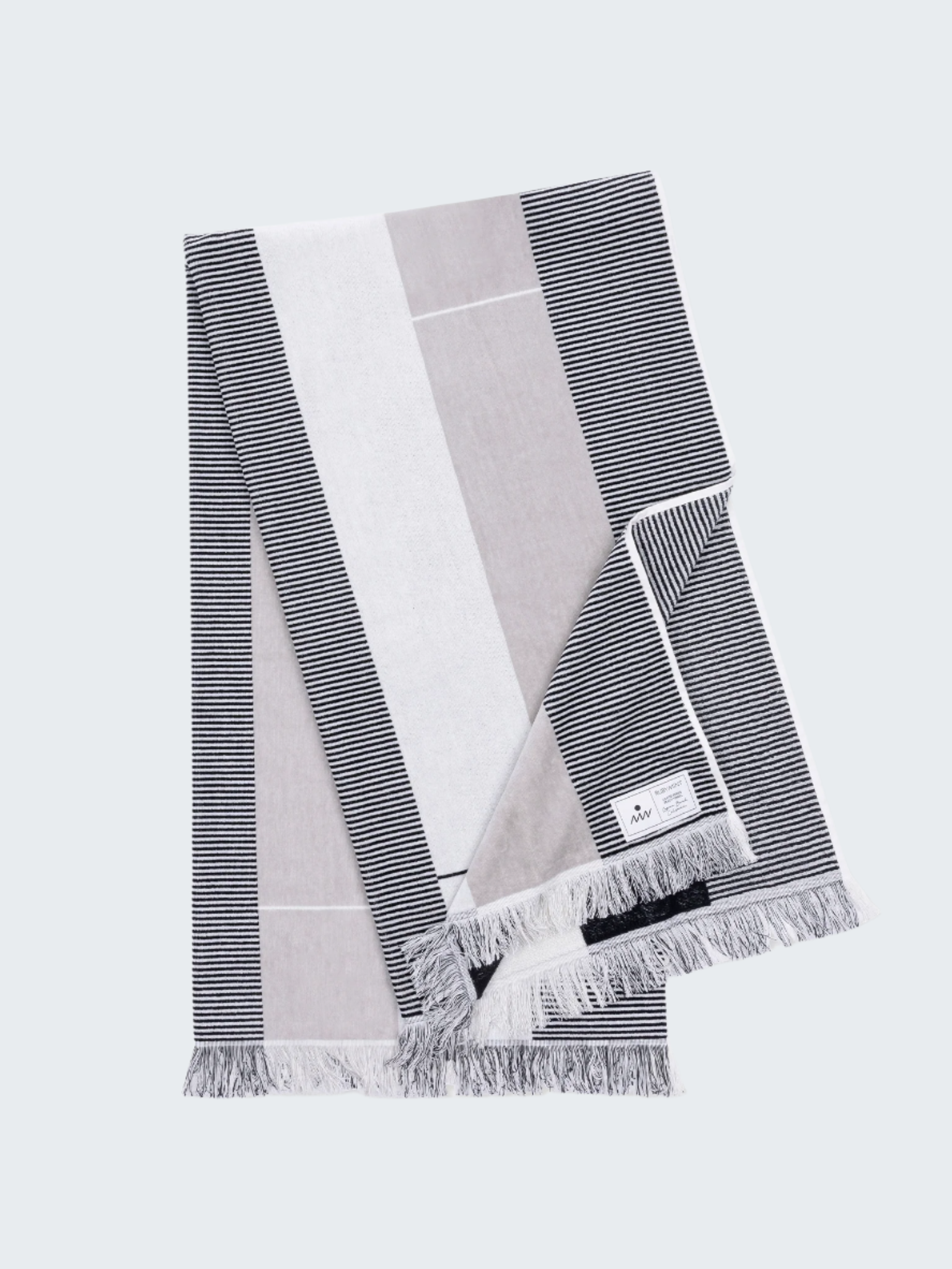Set of three striped scarves in gray, white, and black on a white background