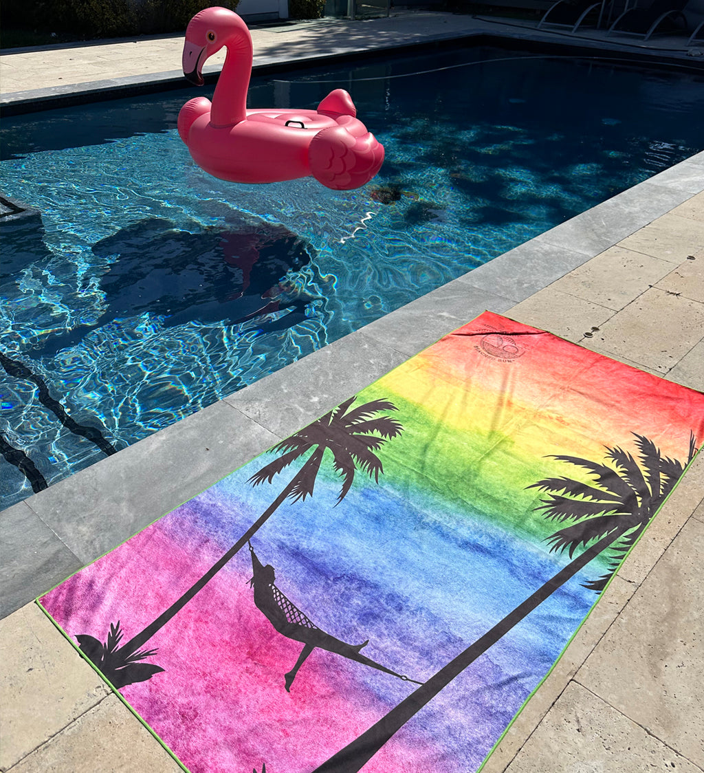 Colorful towel with flamingo design on a poolside