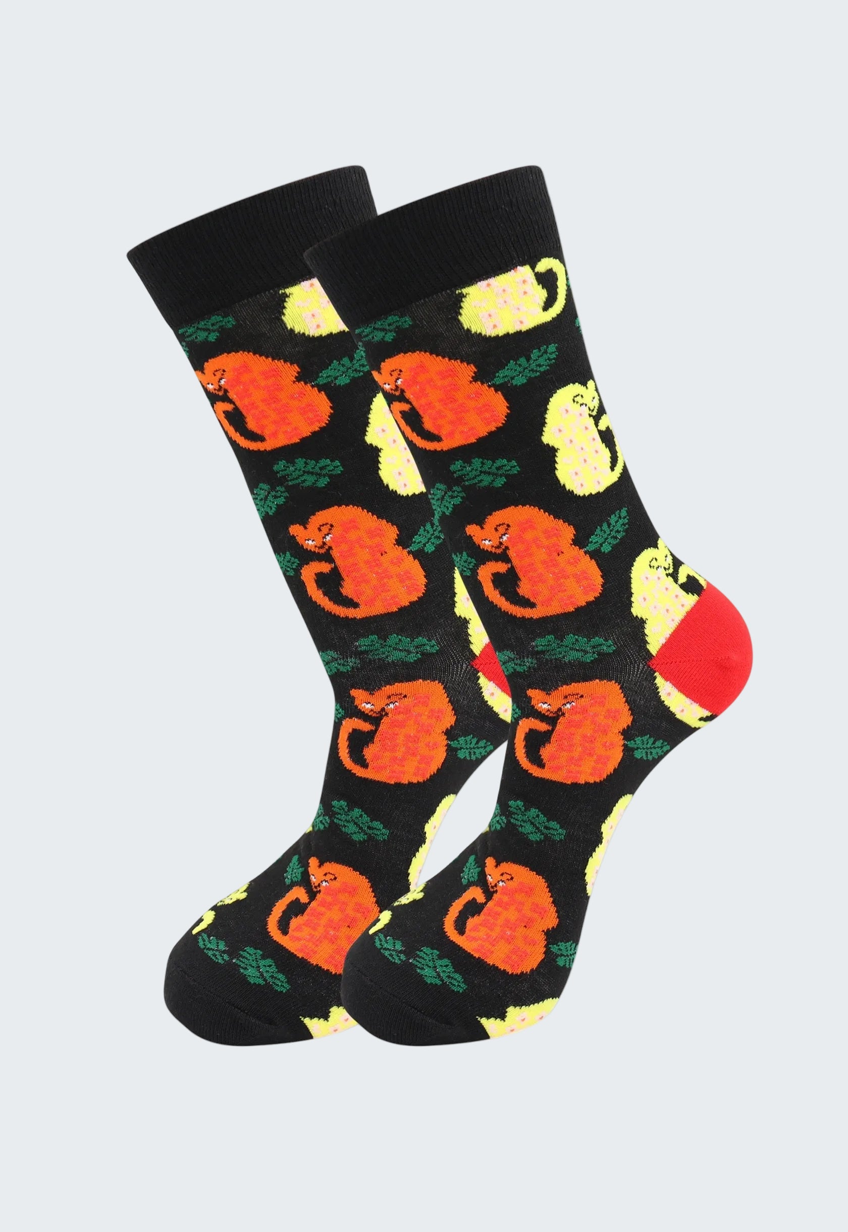 Black socks with orange fox and yellow flower pattern on a white background