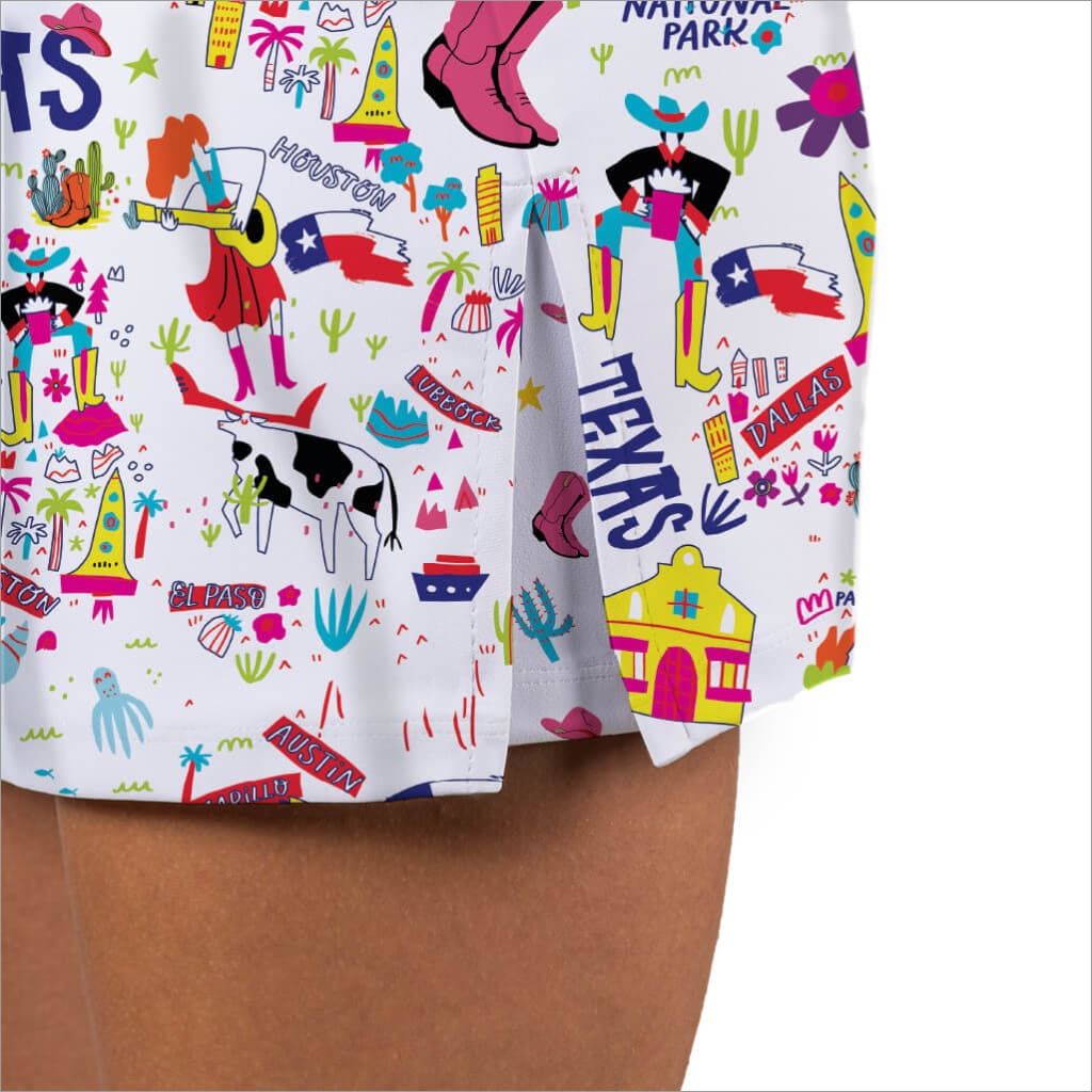 Colorful Texas-themed fabric with various symbols and text on a white background.
