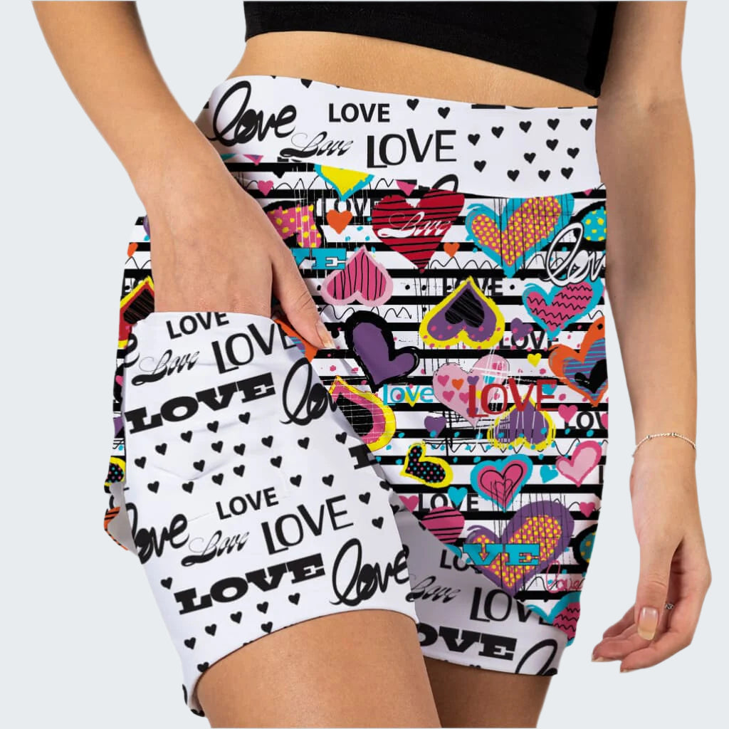 Colorful shorts with 'love' and heart designs on a white background