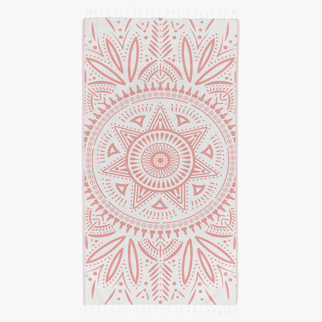 Towel with pink mandala pattern on a white background