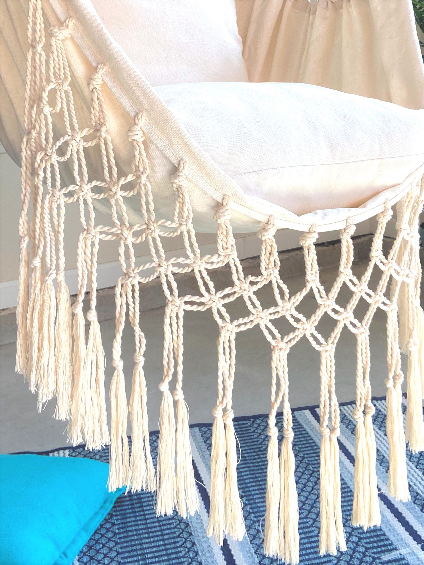 Macrame chair hammock with tassels on a chair