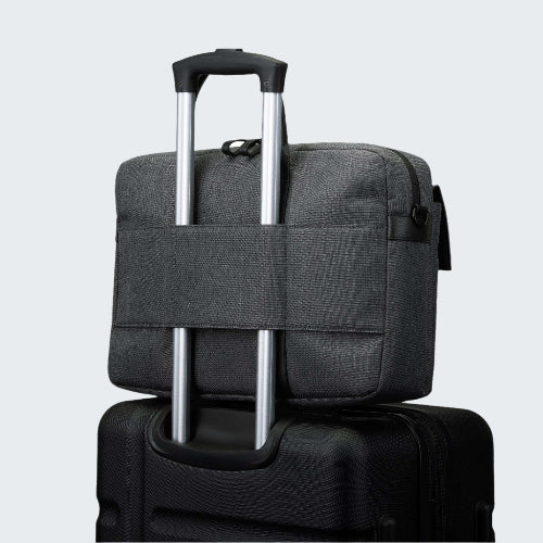 Gray suitcase with a black handle on a white background