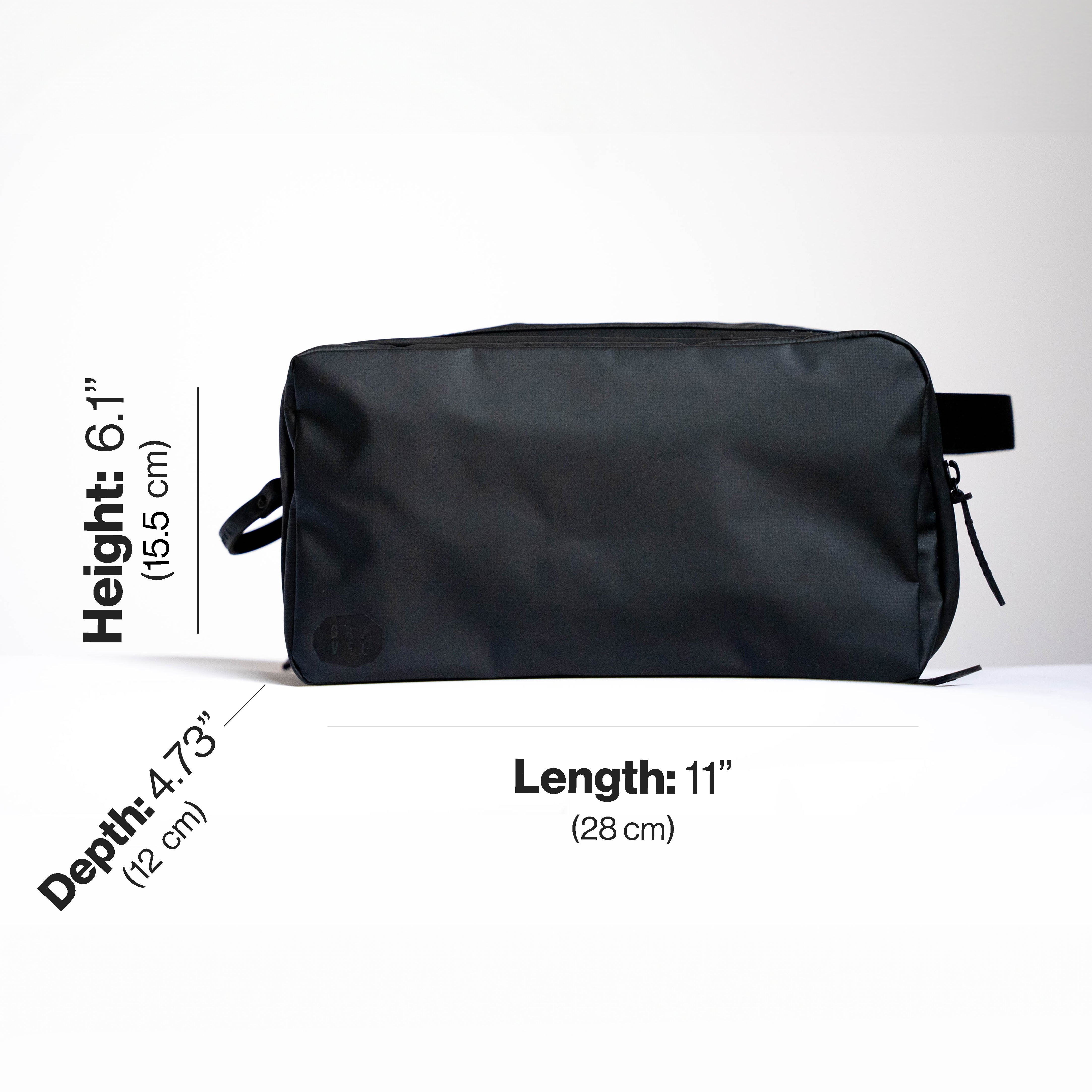 Black toiletry bag with measurements on a white background