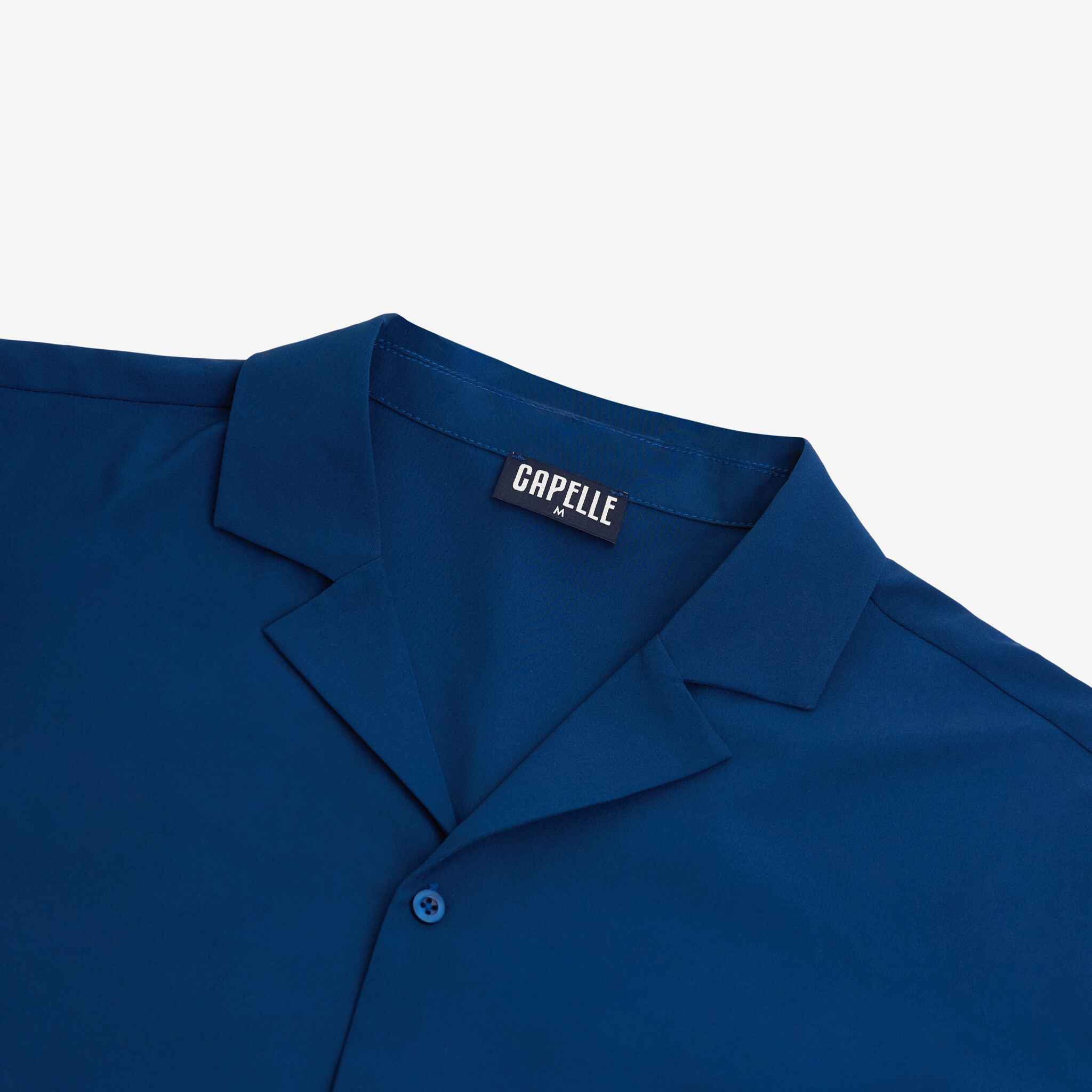 Blue shirt with a Capelle label on a white background