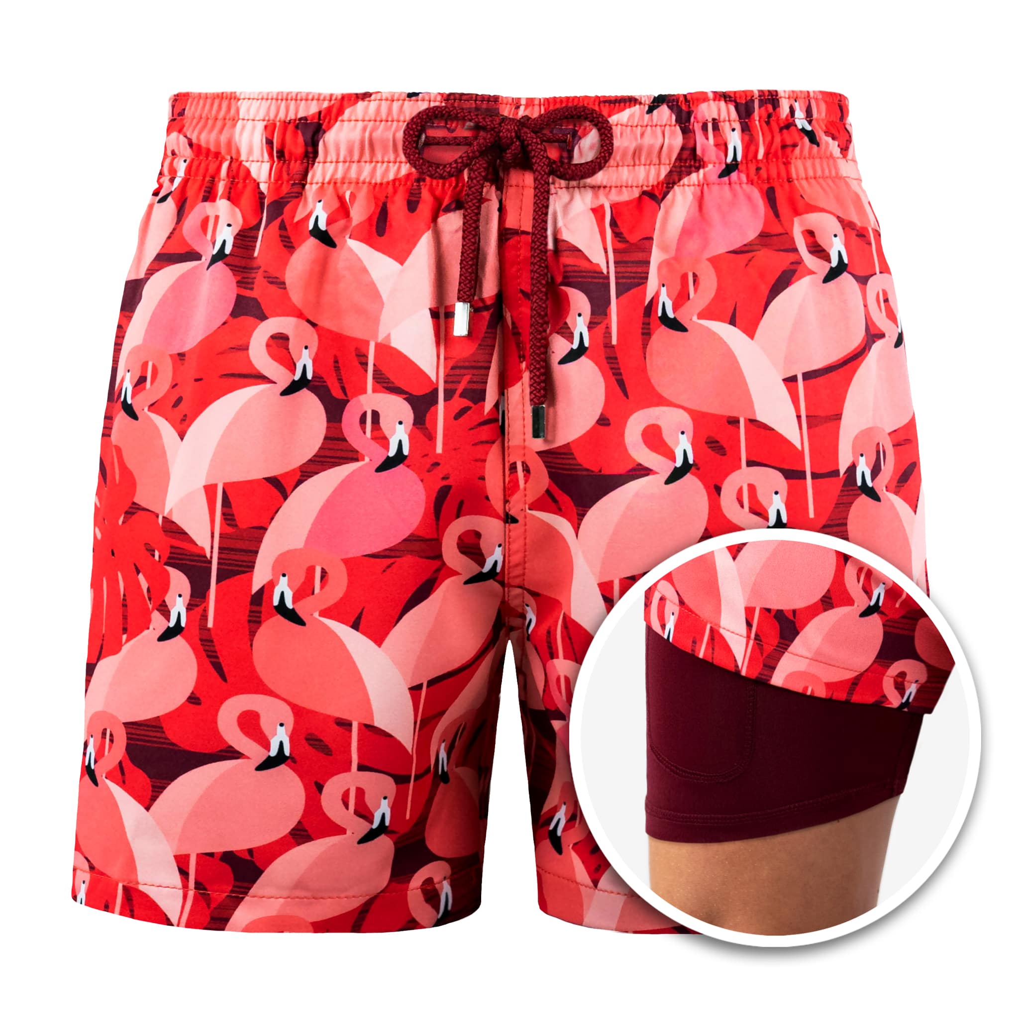 Red swim shorts with flamingo pattern on a white background