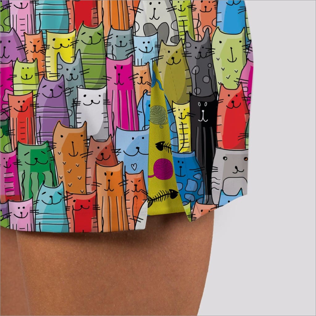 Colorful pattern of cartoon cats on a fabric swatch.