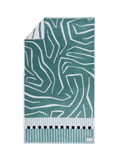 Teal and white patterned towel with black and white border on a white background